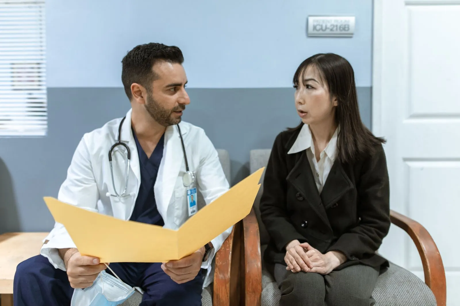 A physician consulting with a patient in a clinical practice setting
